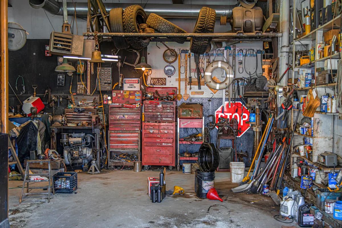 Garage workshop with wall-mounted tools and a storage bench