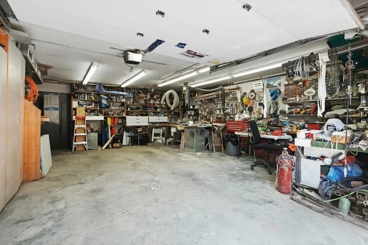Workshop interior with equipment, storage and a concrete floor